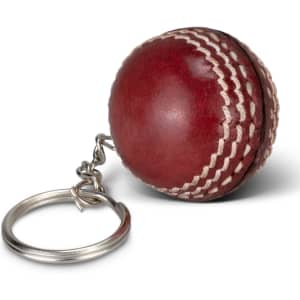 A red cricket ball key ring with white stitching, featuring a metal keychain link.