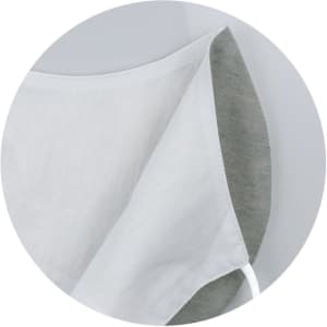 A linen face mask in white and grey, featuring a simple design and a logo on the side.