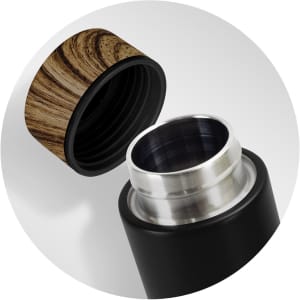 A drink bottle with a sleek black body and a wooden-patterned lid, featuring a stainless steel rim.