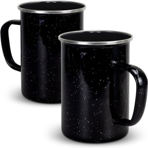 A drinkware set featuring two black enamel mugs with a speckled design and metal rims.
