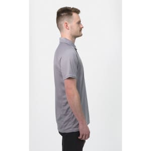 A grey men's polo shirt with a collar, featuring a subtle logo, displayed on a model from the side.