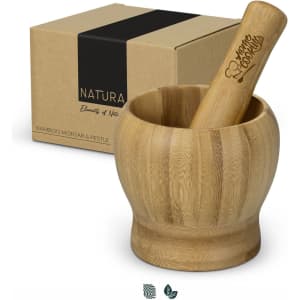 A bamboo mortar and pestle set in a natural finish, accompanied by a branded box.