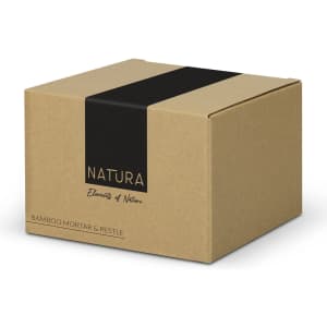 A brown cardboard box featuring a black stripe and logo, containing a NATURA bamboo mortar and pestle.