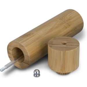 A bamboo pepper mill with a cylindrical body, a removable top, and a metal grinding mechanism.
