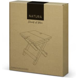 A brown cardboard box containing a bamboo folding wine table, featuring a simplistic line drawing and a logo.