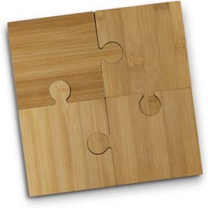 A set of four bamboo puzzle coasters in varying shades of light brown, featuring interlocking pieces.
