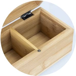 A bamboo tea box featuring a spacious compartment and a separator, showcasing its natural wood texture.