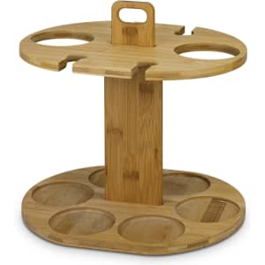 A bamboo wine rack with a circular design, featuring six circular bottle holders and a handle on top.