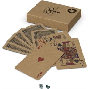 A set of kraft playing cards displayed alongside their brown cardboard box, featuring intricate designs and a logo.