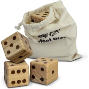A set of three wooden yard dice in a cream drawstring bag, featuring black dots for numbers.