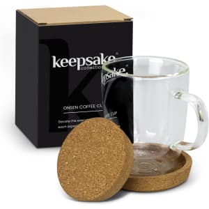 A coffee mug with a clear glass body, a handle, and a cork coaster, presented in a black box.