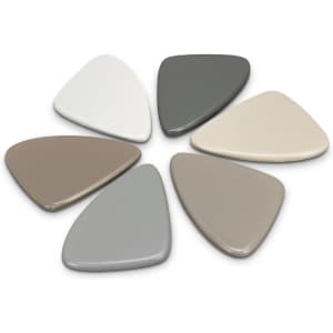 A set of six pebble-shaped coasters in various shades of grey, beige, and white, featuring a smooth finish.