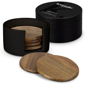 A set of wooden coasters displayed beside a black cylindrical holder and a round black container with a logo.