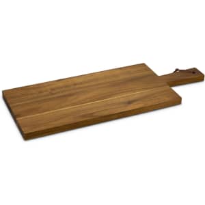 A wooden chopping board in a warm brown hue with a rectangular shape and a handle. Features a small leather loop.