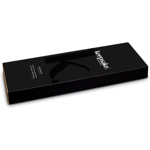 A black packaging box for the Keepsake Carving Set, featuring a logo and a sleek, modern design.