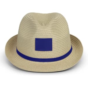 A light beige fedora hat featuring a blue band and a blank area for branding. The texture is ribbed.