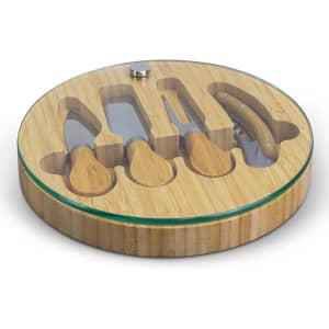 A bamboo cheese board with a glass top, featuring four cheese knives and a recessed area for serving.