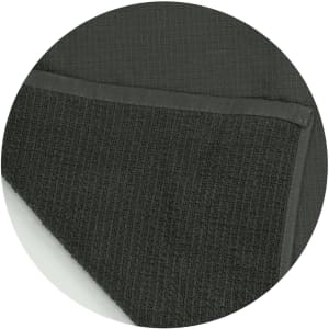 A dark green waffle towel with a textured surface and a smooth border, featuring a branding logo.