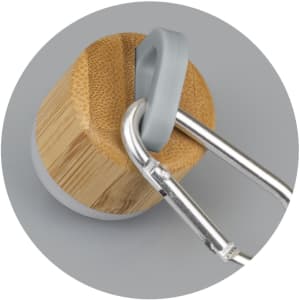 A drink bottle with a bamboo base and a grey carabiner, featuring a round design. The bottle has a metallic finish.