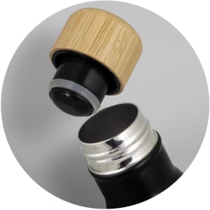 A drink bottle with a black body and a natural bamboo cap, showcasing its open top and stainless steel interior.