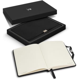 A gift set featuring a black notebook with lined pages, presented in a sleek black box. The set includes branding.