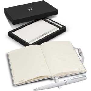 A gift set featuring a white notebook with lined pages and a silver pen, presented in a sleek black box.