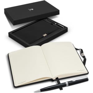 A black notebook with lined pages and a silver pen, presented in a black gift box.