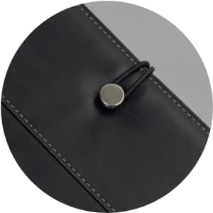 A black Melrose Portfolio with a button closure detail and contrasting stitching. It features a logo.