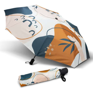 A compact umbrella with a colourful abstract design in shades of blue, orange, and cream, with a matching sleeve.