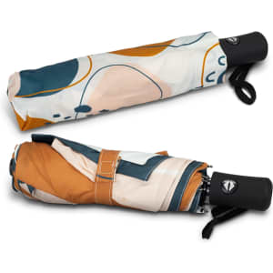 A compact umbrella featuring a vibrant pattern in shades of orange, teal, and cream, with a black handle and logo.