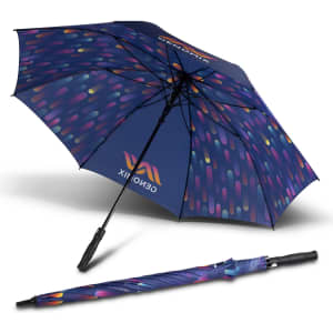 A full colour umbrella with a navy blue canopy featuring a vibrant multicoloured pattern, partially open and closed.