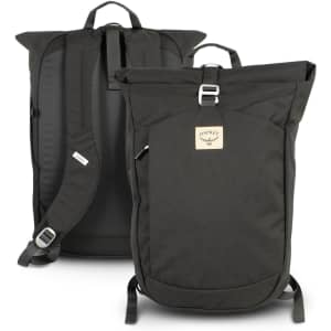 A roll top backpack in dark green with adjustable straps and a logo on the front. Features a minimalist design.