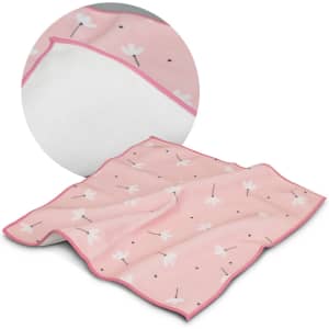 A soft pink blanket featuring a floral pattern, with a white textured underside and a contrasting border.