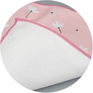A medium blanket featuring a pink floral design on one side and a soft white underside. It has a contrasting pink trim.