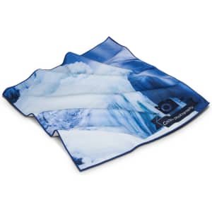 A large blue and white patterned cloth with an abstract design, featuring a logo in one corner.