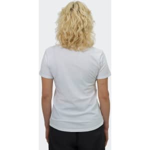 A white women's t-shirt from the back, featuring short sleeves and a fitted design. The model has wavy blonde hair.
