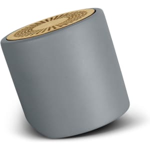 A grey limestone Bluetooth mini speaker with a wooden top, featuring a circular design and a brand logo.