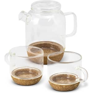 A glass teapot with two matching cups featuring cork bases, showcasing a clear and natural aesthetic.