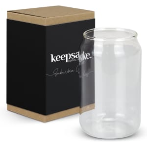 A clear glassware jar is displayed next to a black box featuring a logo. The jar has a simple, elegant design.