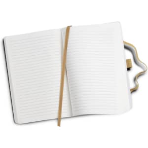 A Beaumont Stone Paper Notebook with a soft cover, featuring lined pages and a ribbon bookmark in a natural tone.