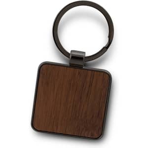 A square key ring with a wood grain design and a metallic clip, featuring a logo on the metallic part.