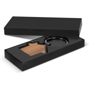 A house-shaped key ring featuring a wooden design, presented in a sleek black box.