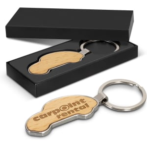 A car-shaped key ring with a wooden design, presented in a black box. Features a branding logo.