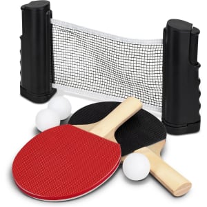 A portable table tennis set featuring two paddles in red and black, three white balls, and a black net with clamps.
