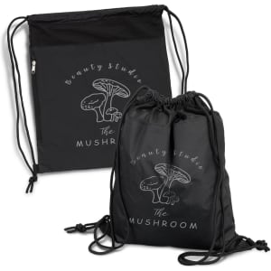 A black drawstring backpack featuring a graphic of a mushroom and a logo. It has adjustable cords for closure.