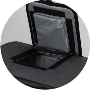 A black cooler bag with a grey insulated section and a zippered access point. It features a branding logo.