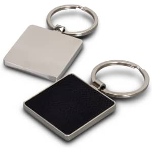 A square key ring featuring a silver metal finish with a textured black surface on one side and a smooth silver back.