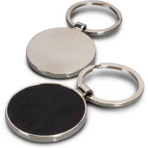 A round key ring with a polished silver finish and a black leather backing. It features a branding logo.