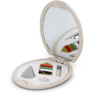 A compact sewing kit with colourful threads, a needle, a threader, and a mirror in a light-coloured case.