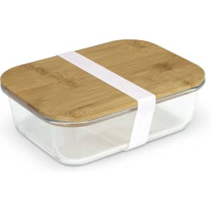 A glass lunch box with a bamboo lid, secured with a white band.
